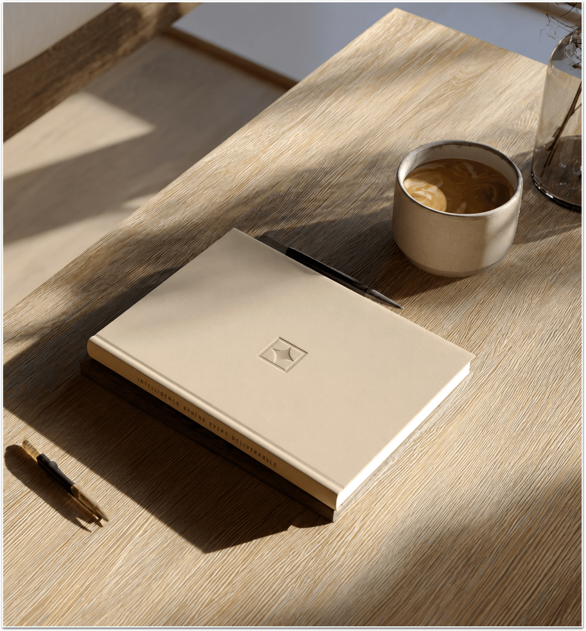 A Ledra-branded journal beside coffee on a desk